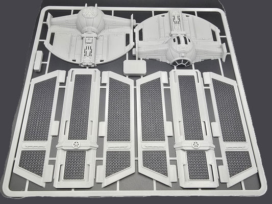Model kit parts on a gray background
