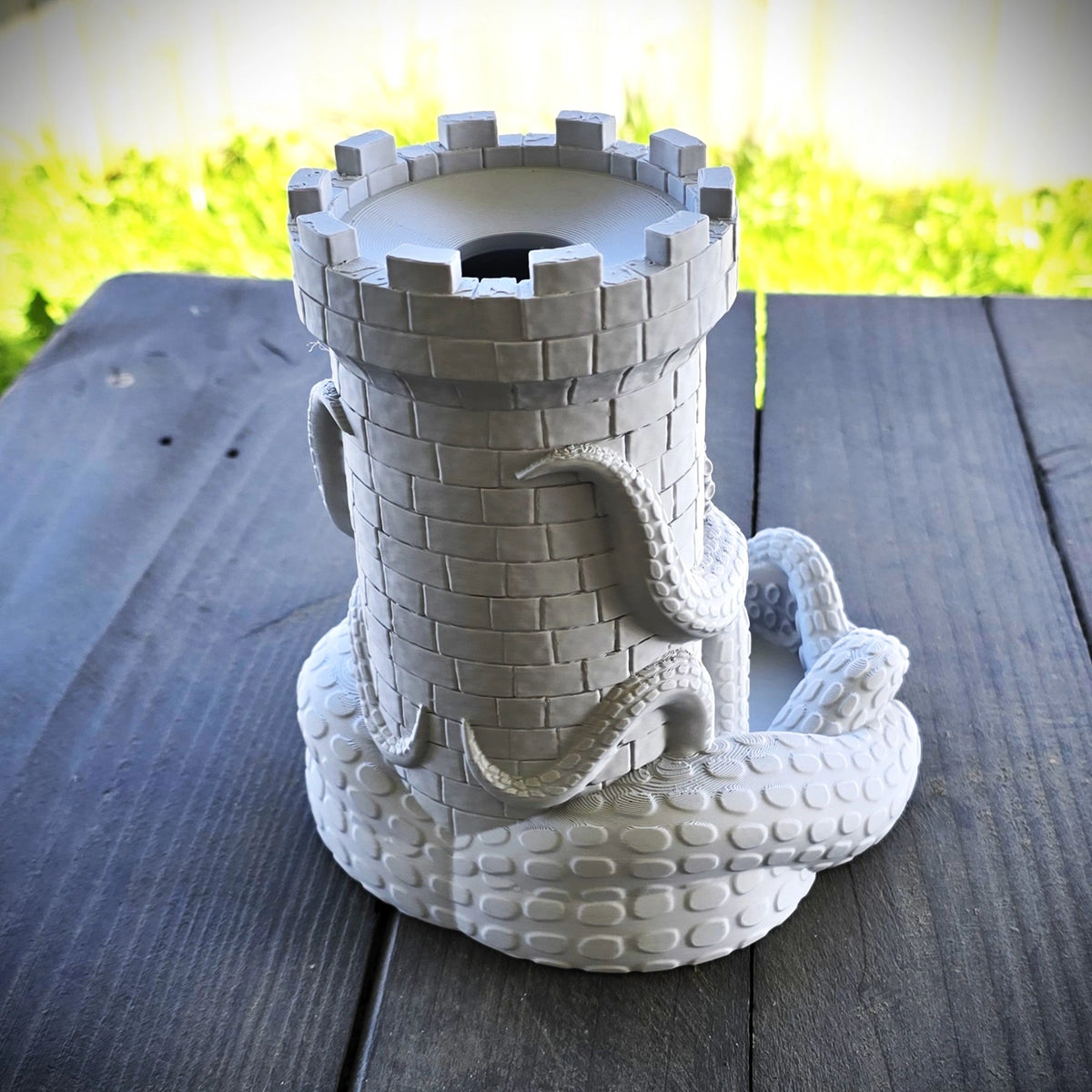 Kraken wrapped around castle turret dice tower