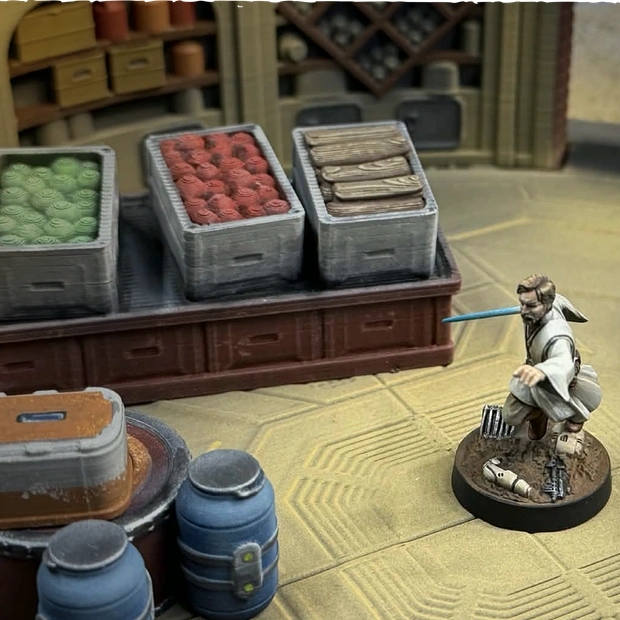 Star Wars Shatterpoint terrain and Star Wars Legion terrain - Miniature figure on a textured surface with crates and containers in the background